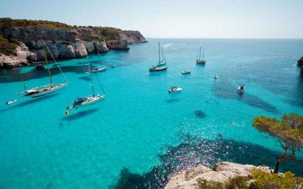 Menorca---getting-there---boats-in-macarella-xlarge